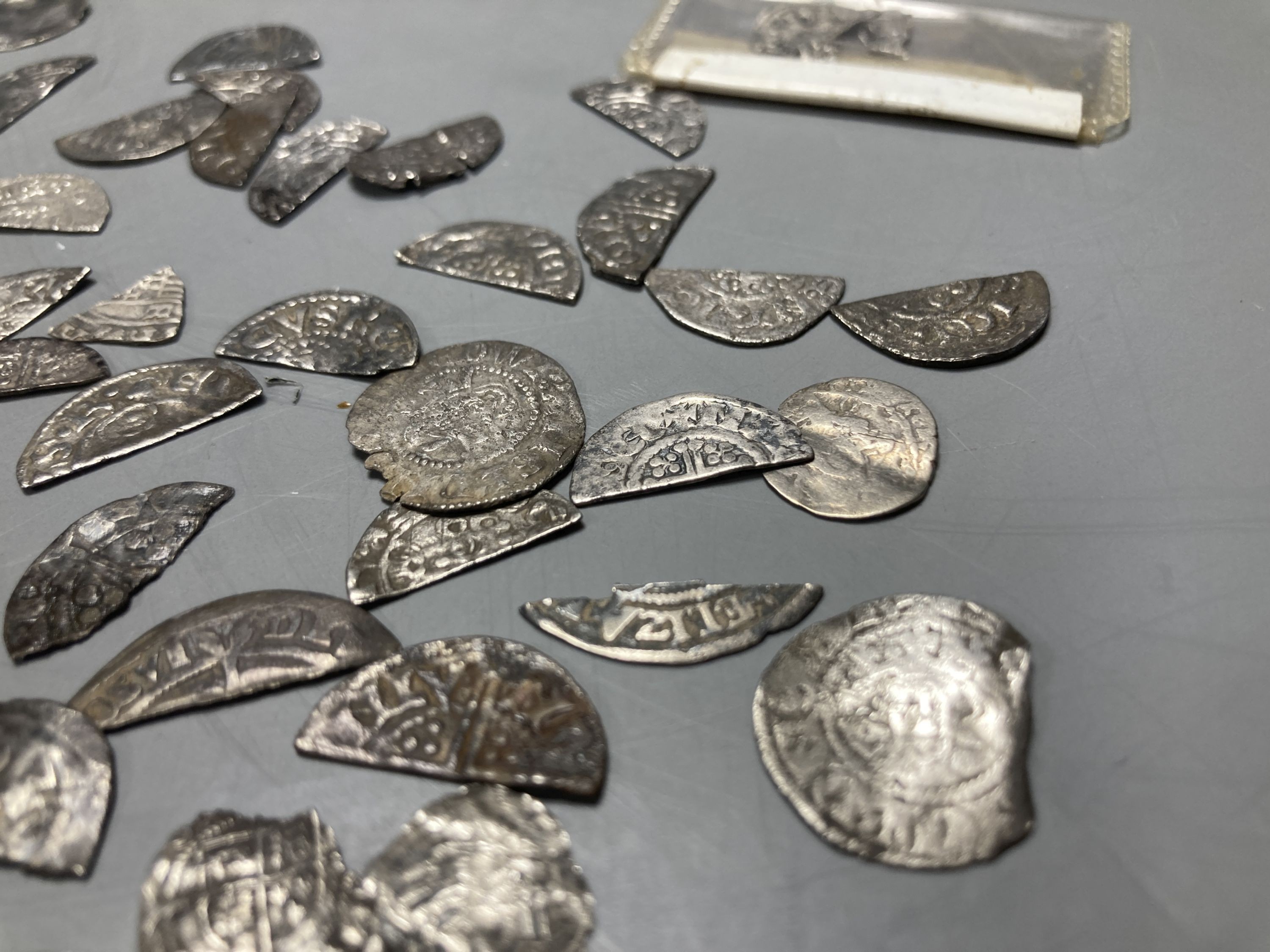 Medieval to Tudor hammered coinage - a collection of cut half and quarter short and long cross pennies and other fragments